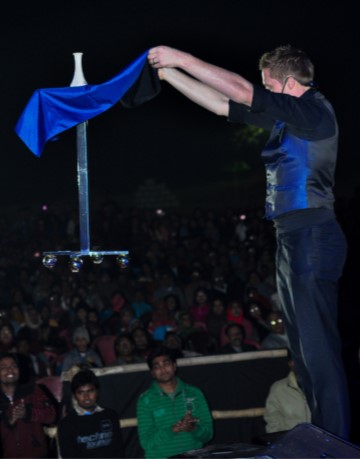 Comedy Corporate Stage Magician Martin John performing 'Floating Table' illusion