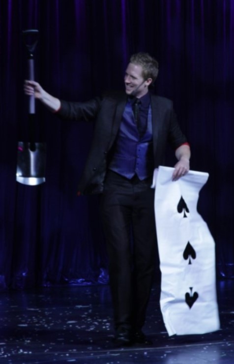Corporate Comedy Stage Magician Martin John appearing a spade!